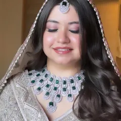 A close-up of Priyal's makeup. I used soft pink tones on her eyes and lips, paired with a flawless airbrush base, to create a look that is both romantic and modern.