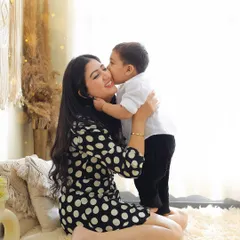 A sweet kiss from a son to his mom. We focus on capturing these small, tender interactions that mean so much during our mother and child photoshoots.