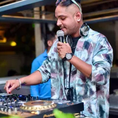 On the mic and on the decks, I'm always interacting with the crowd. It's about creating a shared experience, not just playing a playlist. This was at a fun night at Hungry Hippie.