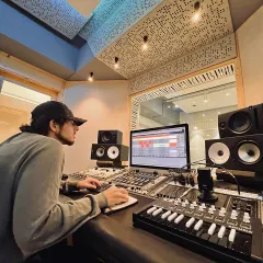Our engineer working with an artist at the mixing desk. We love being part of the creative process and helping musicians achieve their vision.