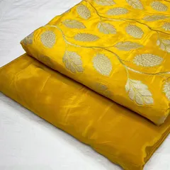 A bright and cheerful yellow jacquard fabric paired with its matching plain crepe. This combination is perfect for creating stylish and comfortable daywear or festive outfits.