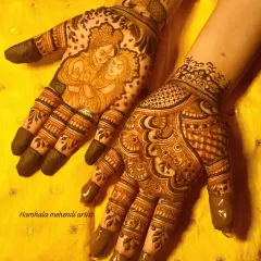 A special design for Karwa Chauth featuring a portrait of Radha and Krishna. The other hand is filled with intricate traditional patterns, creating a beautiful and devotional set.