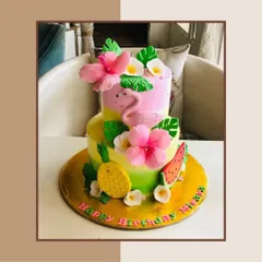 This vibrant, tropical-themed birthday cake features a flamingo, pineapple, and hibiscus flowers. I can craft a custom cake to match any party theme you have in mind.