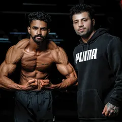 Posing with a client after a successful photoshoot. My support extends beyond the gym floor to every aspect of their fitness journey.