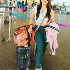 At the airport, ready to board a flight to Udaipur for a wedding. My work as a destination event host involves complete dedication, from traveling to the location to spreading happiness at the event itself.
