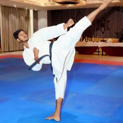I lead by example. This is a demonstration of a yoko geri (side kick), showing the power, balance, and flexibility that I work to instill in all my students.