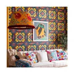 This living space demonstrates how a bold wallpaper, paired with a custom-coordinated lampshade and colourful cushions, can create a cohesive and electrifying atmosphere. I guide clients in layering patterns for a result that is daring yet harmonious.