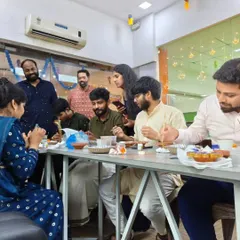 It’s all about shared moments. This candid shot shows team members enjoying the activity and each other's company during a special office event.