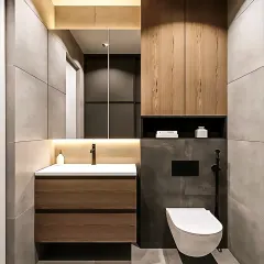 A minimalist bathroom design with large grey tiles and wood-toned cabinetry. The backlit mirror and simple, clean lines create a serene and modern space.