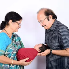 There's a special kind of magic when grandparents hold their grandchild for the first time. This multi-generational portrait captures that priceless, heartwarming bond that your family will cherish for generations to come.