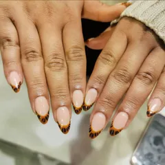 A walk on the wild side. We gave the classic French a fun twist with this hand-painted leopard print design on the tips.