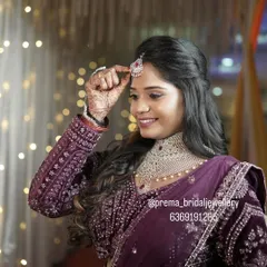 A candid moment as she adjusts her maang tikka, part of the complete reception set.