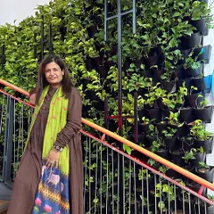 Here I am with the completed "Narcissus Project" green wall. This living wall is situated along a staircase, turning a transitional space into a central feature of the office and improving air quality with every step.
