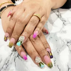 I'm so proud of my students' work. This fantasy nail set with multi-color ombre, flame details, and sculpted 3D roses was created by a student after just three days of training.