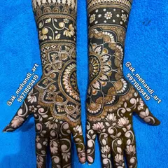A beautiful engagement mehndi design. The patterns are elaborate, combining mandalas with floral work, creating a stunning look for your ring ceremony.