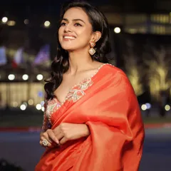 For the 'Daku Maharaj' promotions in Dallas, I styled Shraddha Srinath in this beautiful orange saree. The contrasting embroidered blouse adds a pop of color and intricate detail, making it a radiant and classic choice.