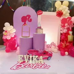 A modern and chic Barbie theme for Evika's 7th birthday. We used shades of pink and lilac, with silhouette props and a toy car for a stylish and playful celebration.
