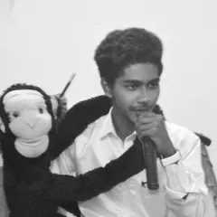 A black and white shot of me performing with my main sidekick, Sandy the monkey. This captures the dynamic between me as the straight man and him as the cheeky comic relief.