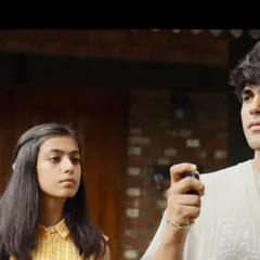 This scene shows a younger generation's story. I styled the young man in a casual graphic tee and the girl in a cute yellow checkered dress, creating a youthful and sweet vibe.