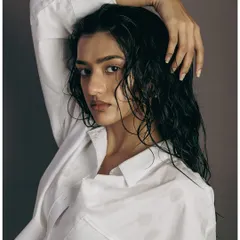The "wet look" is a classic editorial style. Here, I focused on capturing the glossy texture and piecey separation of the hair. The model's pose, with her hand running through her hair, emphasizes the look and feel of the styling.