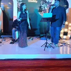 A closer look at our singers engaging with each other during a live performance. Their on-stage chemistry helps create a lively and entertaining atmosphere for all your guests.