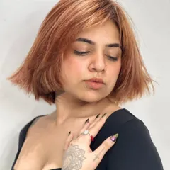 A softer angle of the copper bob, showing the texture and movement in the cut. The color has a beautiful shine, proving that bold color can also be healthy.