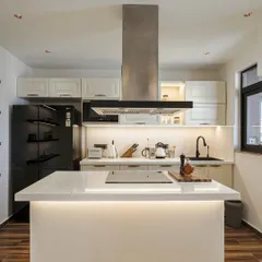 Another view of the kitchen from image 5, emphasizing the clean lines and functional layout.