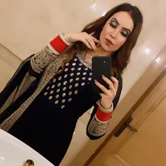 A dramatic smokey eye for a post-wedding function. This look, paired with her traditional red chura, is bold and confident, perfect for a newlywed celebrating with family.