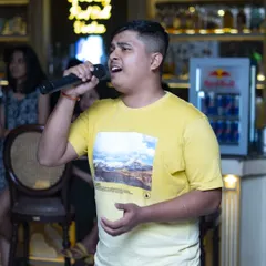 A passionate solo performance during one of my Sunday karaoke sessions. I make sure every singer gets their moment in the spotlight.