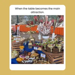 I design my grazing tables to be the main attraction of any party. This setup combines rustic wooden crates with elegant serveware to display a wide array of appetizers, cheeses, and fruits, creating an impressive visual and culinary experience.
