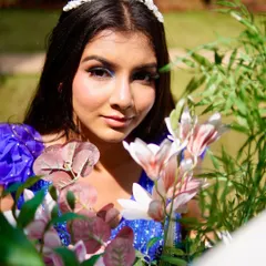 A closer look at the makeup for the blue gown shoot. You can see the subtle shimmer on the eyelids and the fresh, dewy skin finish, which was essential for this outdoor, natural light setting.