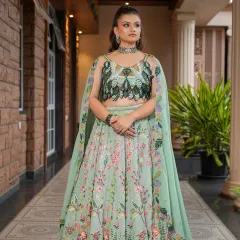 For a fresh and modern pre-wedding or reception look, I recommend this beautiful pastel green floral lehenga. The unique leaf-patterned blouse and light, airy skirt are perfect for daytime functions or an outdoor celebration.