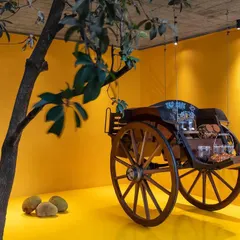 The Tonga Court Cafe within our studio, an event and social space. We repurposed a vintage cart as a centerpiece, demonstrating our philosophy of finding new life for old objects within contemporary settings.