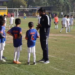 A pre game pep talk with our Under 9 team. We focus on strategy, teamwork, and playing with heart.