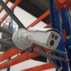 For warehouses and industrial spaces, we mount cameras directly onto racking and structural beams. This Dahua camera is positioned to monitor inventory and loading areas effectively.