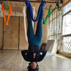 An inverted prayer pose, which is a fantastic way to build shoulder stability and core control. The view from my training in Rishikesh wasn't bad either.