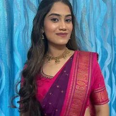 A smiling portrait of the happy client. The makeup is subtle enough for a day event but still feels special.