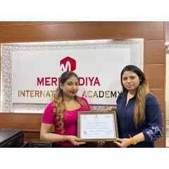 Celebrating another student's success. Her dedication has paid off, and she is now a certified professional ready for the industry.