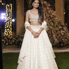 This client looks ethereal in a beige raw silk lehenga by Mirroir. For her event, we chose a piece that was light, elegant, and intricately detailed, allowing her to shine with understated grace.