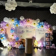 We are over the moon for this baby shower theme. We created a dreamy sky with pastel pink, blue, and purple balloons, fluffy white clouds, and adorable teddy bears for a sweet and memorable gender reveal party.