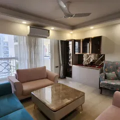 Another angle of the same living room, highlighting the bar and crockery unit in the corner. This shows how I integrate different functional zones into a cohesive and harmonious living and dining area.
