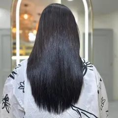 This is the 'after' result of our intensive hair botox treatment. The same hair is now completely transformed to be smooth, straight, and incredibly shiny. This treatment deeply conditions and repairs the hair from the inside out.