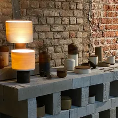 As guest curators at Raw Collaborative, we brought together artists and designers for the 'Intersection' exhibit. This image shows a collection of ceramic and wood objects, a testament to the shared spirit and generosity of our collaborators.