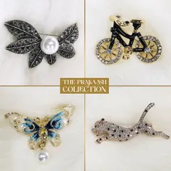 Express your personality with our collection of novelty brooches. This selection includes a pearl-accented leaf, a crystal-studded bicycle, an enameled butterfly with a pearl drop, and a sparkling leopard, each designed to be a conversation starter.