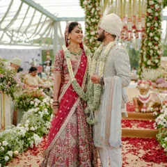 This is the moment that matters most. A happy couple shares a laugh on their wedding day, surrounded by a sea of flowers and joyous guests. I focus on creating a beautiful backdrop for these priceless, unscripted memories.