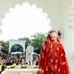 The anticipation before the vows. This view showcases the groom's custom sherwani, designed to stand out with quiet confidence and regal poise.
