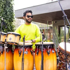A sundowner gig with Farhan Akhtar and the band. I'm on the congas here, providing a smooth, groovy rhythm that's perfect for an evening concert setting.