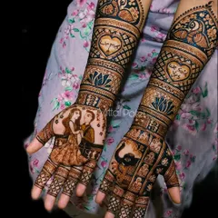 "We Said Yes!" This engagement mehndi celebrates the couple's commitment with a beautiful portrait, surrounded by hearts, lotus flowers, and peacock motifs.