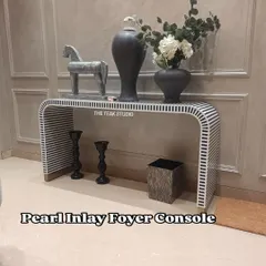 Make a stunning first impression with this pearl inlay foyer console. The striking black and white striped pattern is meticulously crafted using resin inlay, creating a waterfall design that is both modern and timeless. This piece adds bold character and artistic flair to any entryway or living room.
