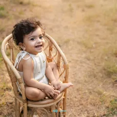 The golden hour light in this outdoor portrait creates a warm and magical feel for this little girl's first birthday.